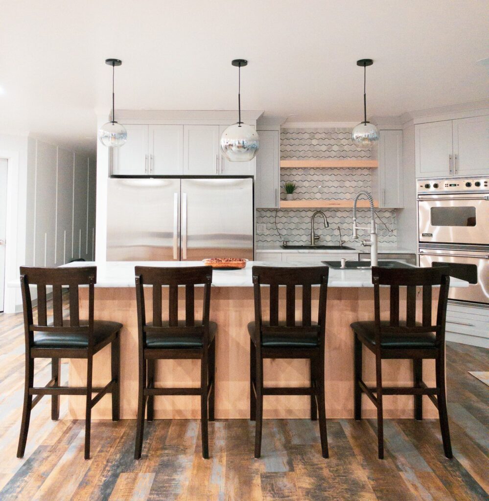 Open kitchen with white cabinets and an island