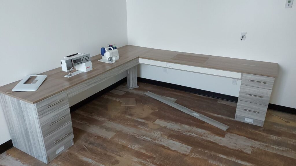 A grey entrance sitting bench with storage