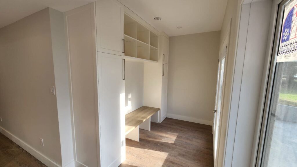 White and tall cabinets in a home entrance