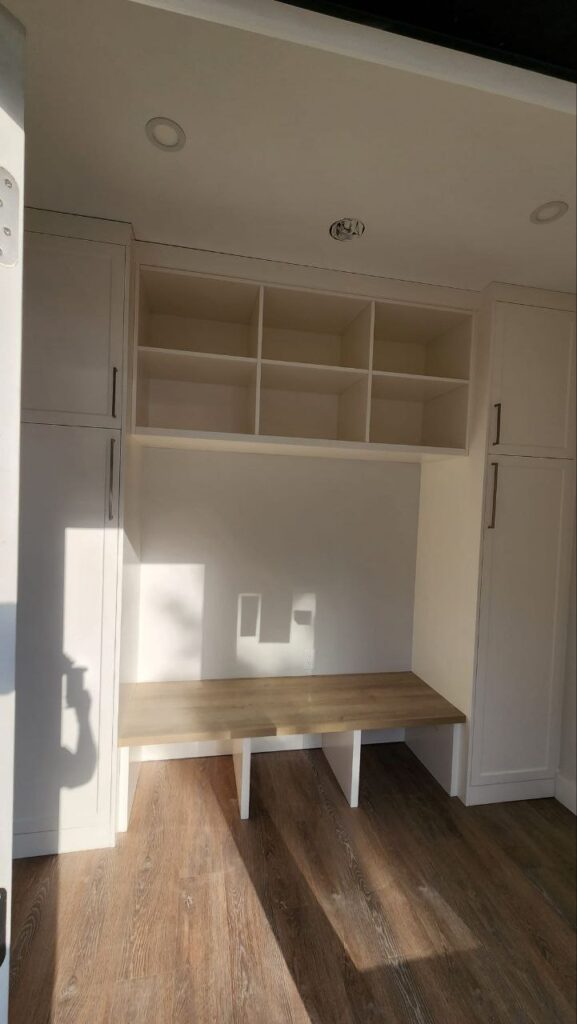Tall white storage cabinets in a room
