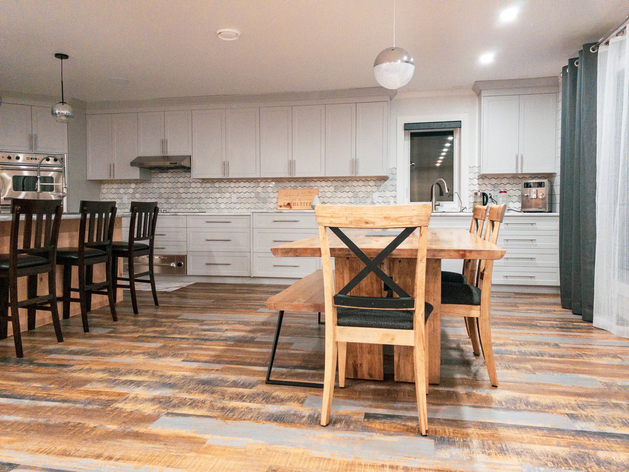 Open kitchen with white cabinets and modern fixtures