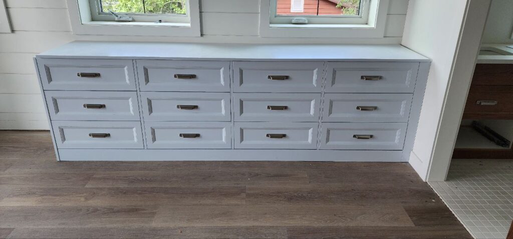 Wide white cabinets steel fixtures