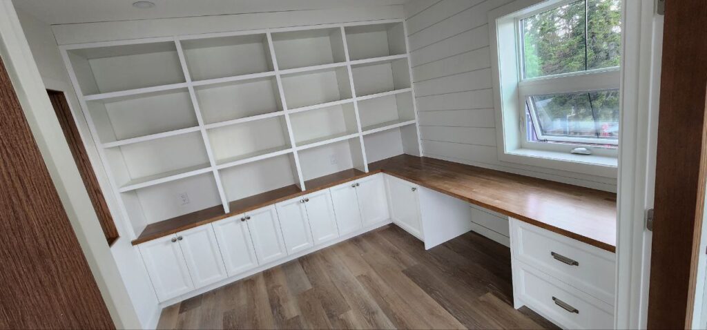 White walk-in closet storage and cabinets