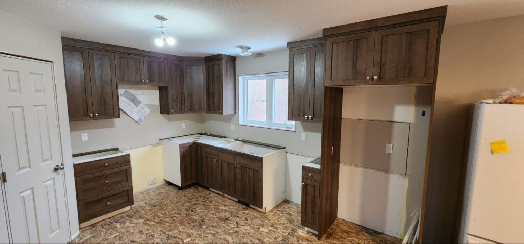 New kitchen with dark wooden cabinetry