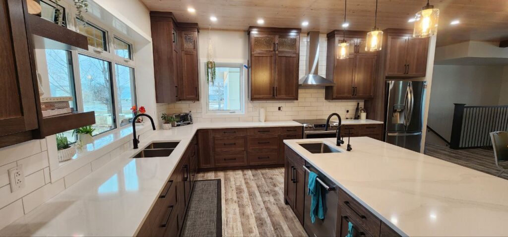 High-end kitchen with large dark brown wooden cabinets and stainless steel appliances.