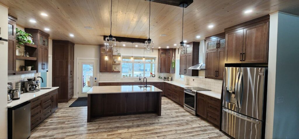 High-end kitchen with large dark brown wooden cabinets and premium finishes.