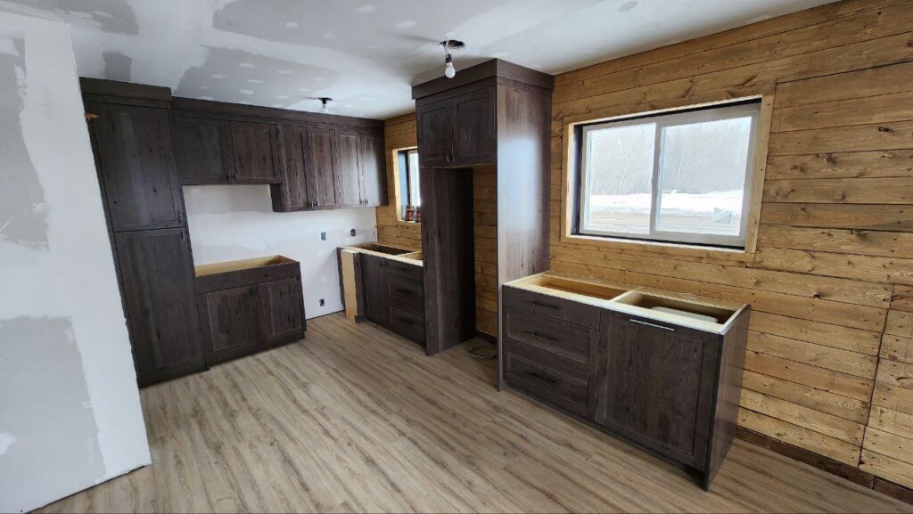 Dark brown cabinets in a wooden cabin house