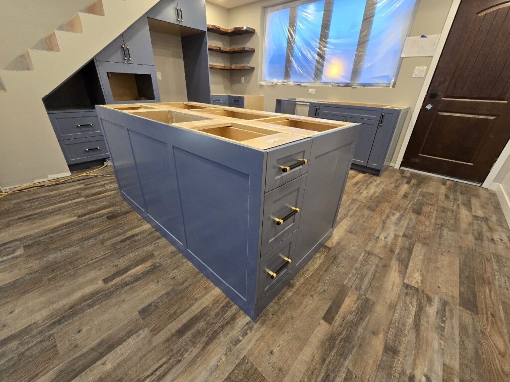 Livid coloured cabinets under a staircase